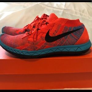 Bright (Hyper) orange & blue Nike Fly Knits